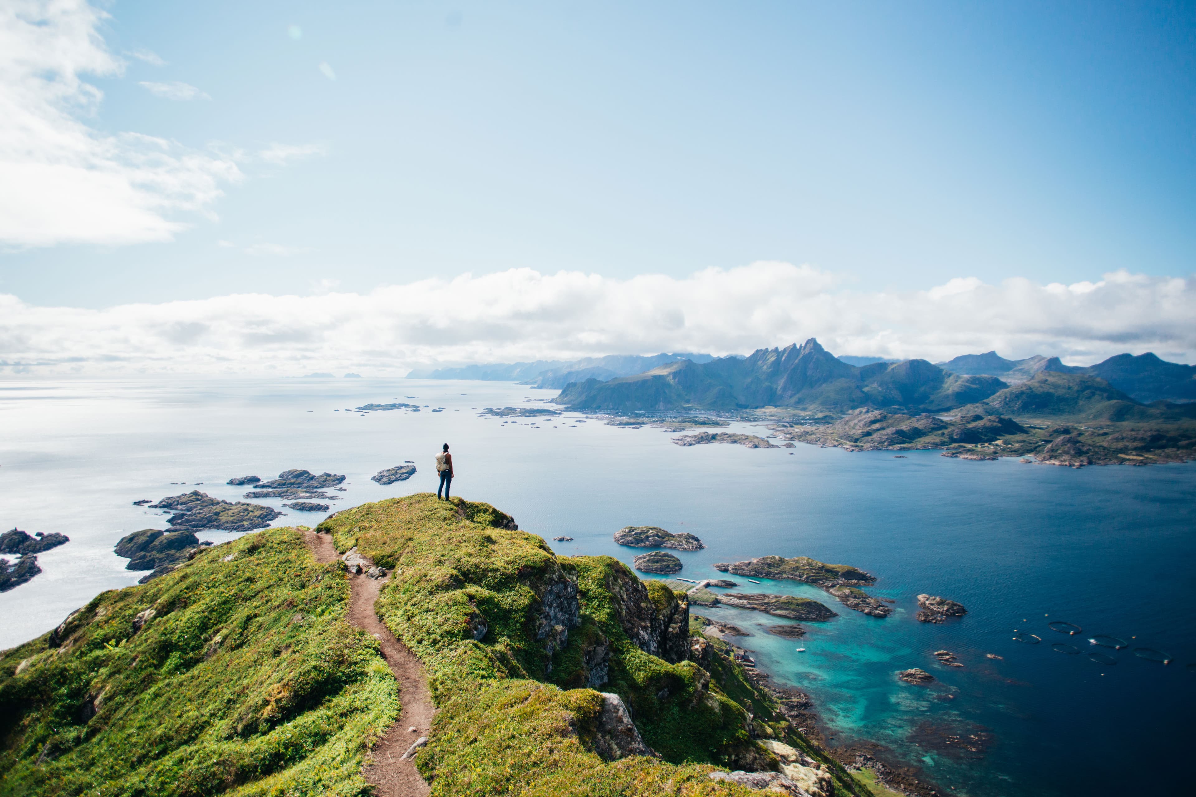 Hiker overlooking a fjord
